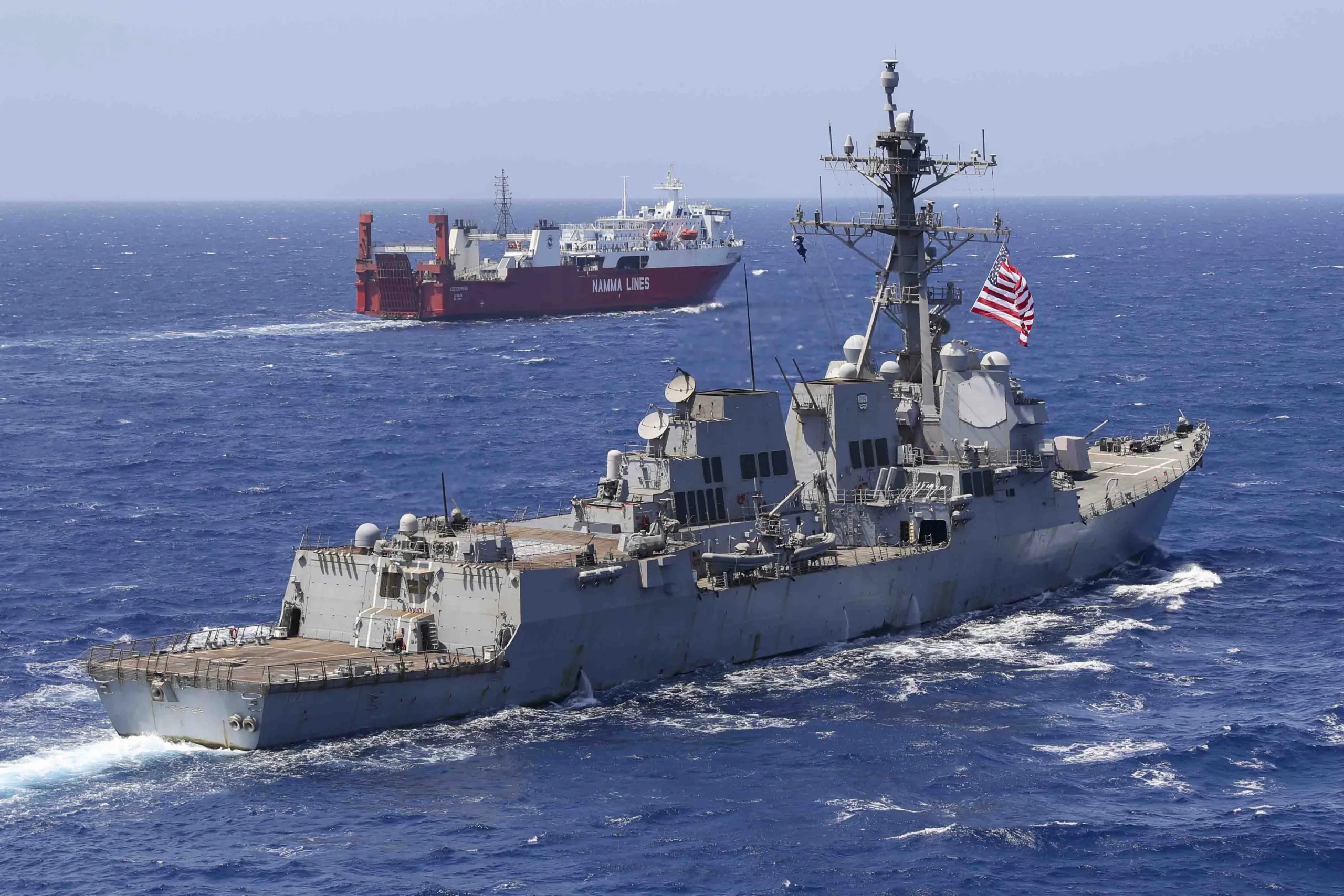 Caption: The Arleigh Burke-class guided-missile destroyer USS Truxtun (DDG 103), left, operates in the Red Sea. [Photo/AFRICOM Public Affairs Office]